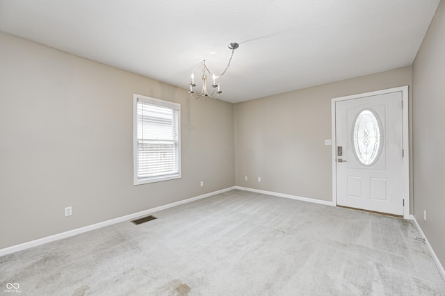 148 S 3rd Ave, Beech Grove, IN 46107 - carpeted foyer with a chandelier and baseboards