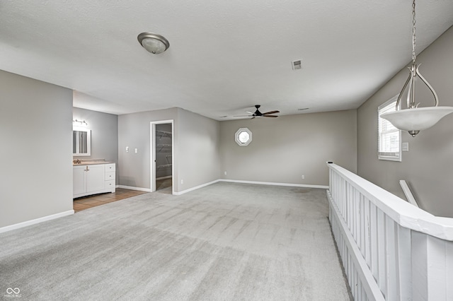 148 S 3rd Ave, Beech Grove, IN 46107 - unfurnished room with light carpet, ceiling fan, and baseboards