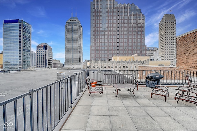 350 N Meridian St Unit A303, Indianapolis, IN 46204 - balcony featuring a skyline view and grilling area