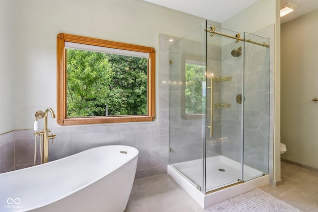 3564 Clear Creek Blvd, Martinsville, IN 46151 - full bath with a freestanding tub, a stall shower, tile patterned flooring, and toilet