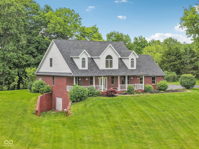3564 Clear Creek Blvd, Martinsville, IN 46151 - new england style home with brick siding, a porch, a front yard, and roof with shingles