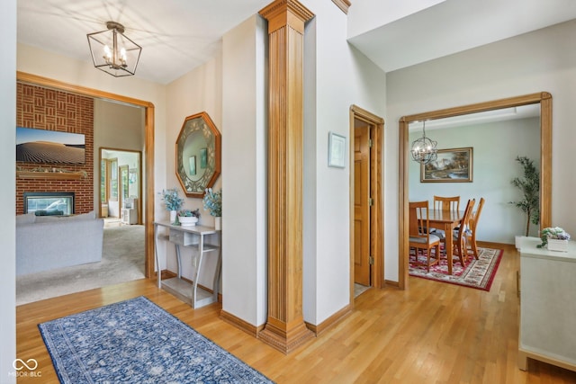 3564 Clear Creek Blvd, Martinsville, IN 46151 - hallway featuring a chandelier, wood finished floors, and baseboards