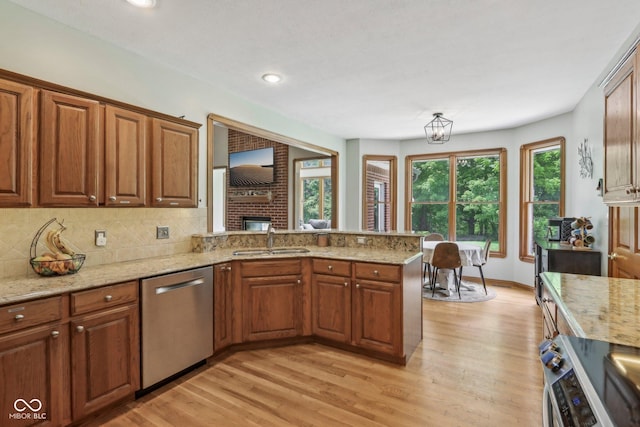 3564 Clear Creek Blvd, Martinsville, IN 46151 - kitchen featuring appliances with stainless steel finishes, a sink, light wood-type flooring, light stone countertops, and recessed lighting