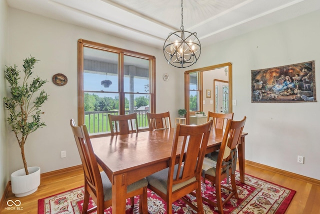 3564 Clear Creek Blvd, Martinsville, IN 46151 - dining space with wood finished floors, a chandelier, and baseboards