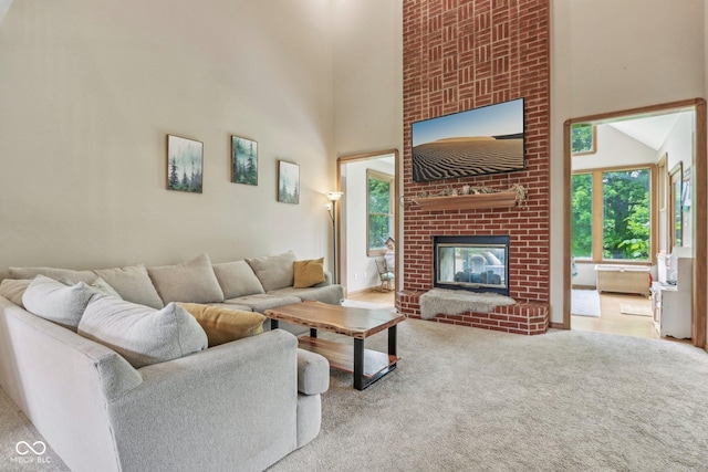 3564 Clear Creek Blvd, Martinsville, IN 46151 - living area with carpet floors, a brick fireplace, and a high ceiling