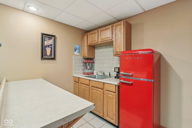 3564 Clear Creek Blvd, Martinsville, IN 46151 - kitchen featuring fridge, a sink, light countertops, decorative backsplash, and light tile patterned floors
