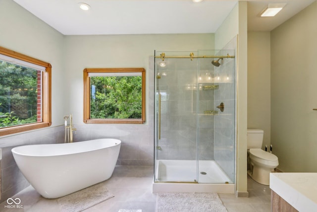 3564 Clear Creek Blvd, Martinsville, IN 46151 - bathroom with tile patterned floors, a stall shower, a freestanding bath, toilet, and recessed lighting