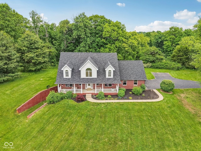 3564 Clear Creek Blvd, Martinsville, IN 46151 - cape cod home with a porch, a front lawn, and brick siding