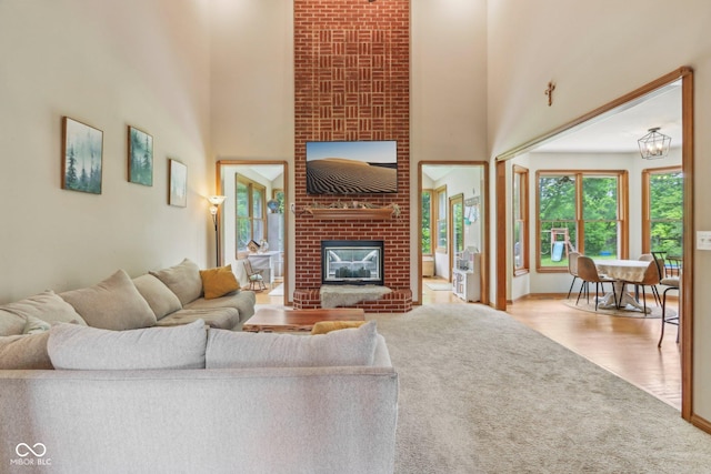 3564 Clear Creek Blvd, Martinsville, IN 46151 - carpeted living area with a high ceiling, a fireplace, and baseboards