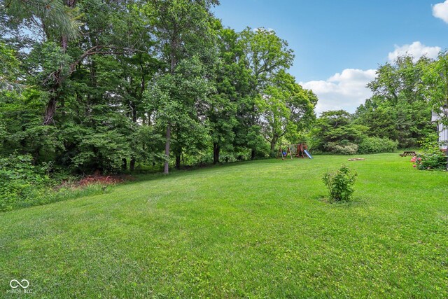 3564 Clear Creek Blvd, Martinsville, IN 46151 - view of grassy yard featuring a playground