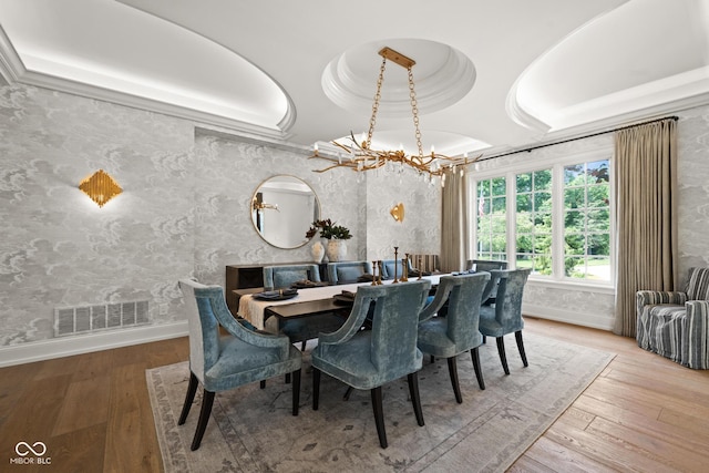11101 Hawthorn Rdg, Fishers, IN 46037 - dining space with a chandelier, hardwood / wood-style floors, and wallpapered walls