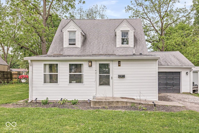 2 S 25th Ave, Beech Grove, IN 46107 - cape cod home with a front lawn, an attached garage, asphalt driveway, and roof with shingles
