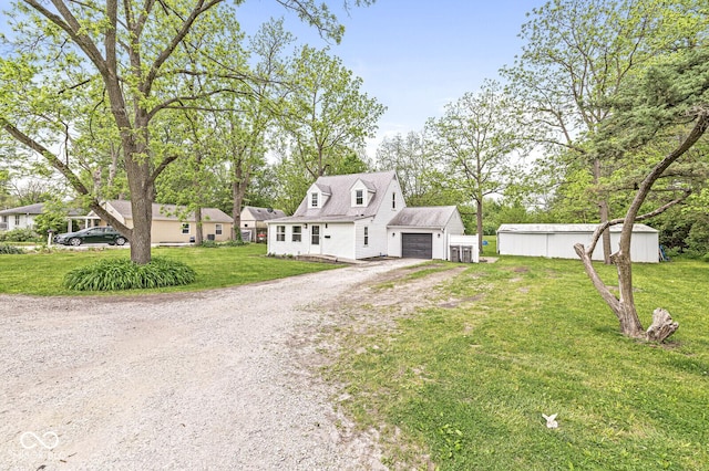 2 S 25th Ave, Beech Grove, IN 46107 - cape cod home featuring driveway, a front lawn, and a garage