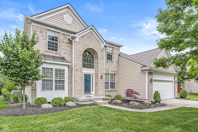 2070 Mustang Chase Dr, Carmel, IN 46074 - traditional home with brick siding, an attached garage, driveway, and a front lawn