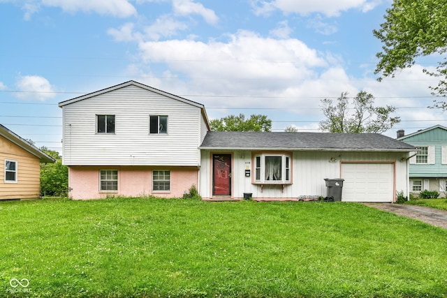 6238 E 43rd St, Indianapolis, IN 46226 - tri-level home with a garage, driveway, a front yard, brick siding, and a shingled roof