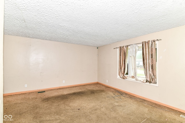 6238 E 43rd St, Indianapolis, IN 46226 - empty room featuring carpet flooring, baseboards, and a textured ceiling