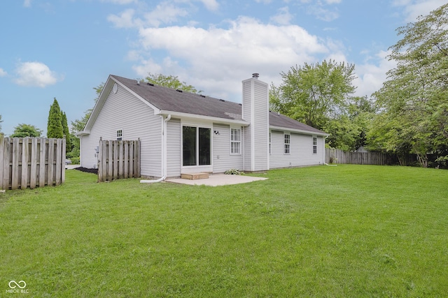 374 Pomona Ct, Greenfield, IN 46140 - back of house featuring a chimney, a patio area, and roof with shingles