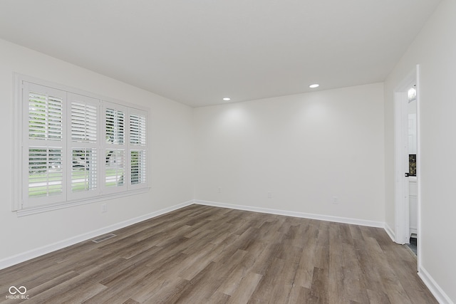 374 Pomona Ct, Greenfield, IN 46140 - spare room with wood finished floors, baseboards, and recessed lighting