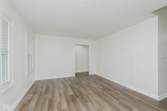 374 Pomona Ct, Greenfield, IN 46140 - unfurnished bedroom with wood finished floors and baseboards