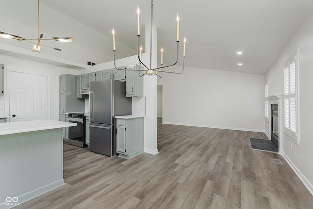 374 Pomona Ct, Greenfield, IN 46140 - kitchen featuring a chandelier, appliances with stainless steel finishes, light countertops, and recessed lighting