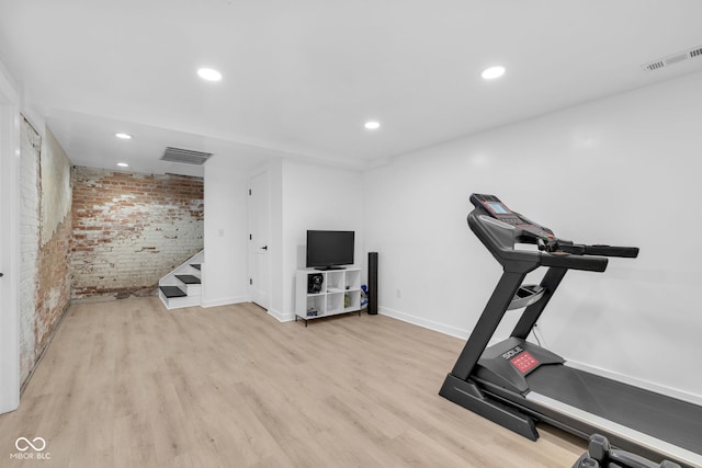 3215 N Pennsylvania St, Indianapolis, IN 46205 - exercise area with brick wall, baseboards, wood finished floors, and recessed lighting