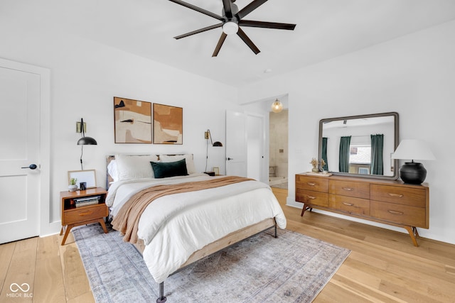 3215 N Pennsylvania St, Indianapolis, IN 46205 - bedroom featuring light wood-type flooring, connected bathroom, and a ceiling fan
