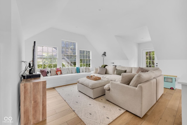 3215 N Pennsylvania St, Indianapolis, IN 46205 - living room featuring vaulted ceiling and light wood-style flooring