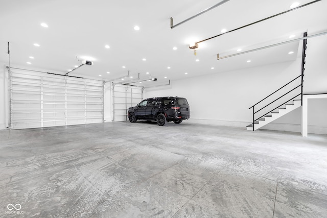 3215 N Pennsylvania St, Indianapolis, IN 46205 - garage with a garage door opener and recessed lighting