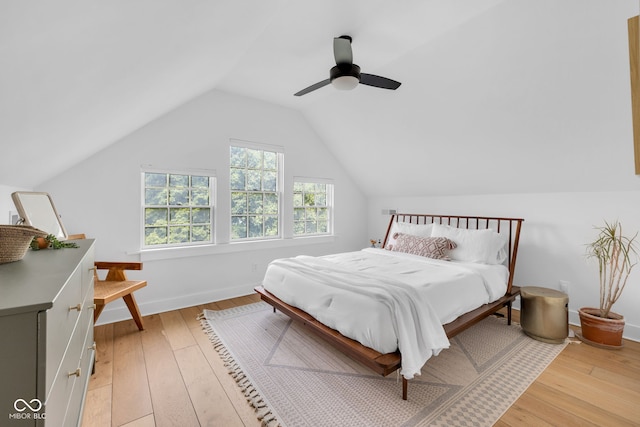 3215 N Pennsylvania St, Indianapolis, IN 46205 - bedroom featuring light wood finished floors, lofted ceiling, ceiling fan, and baseboards