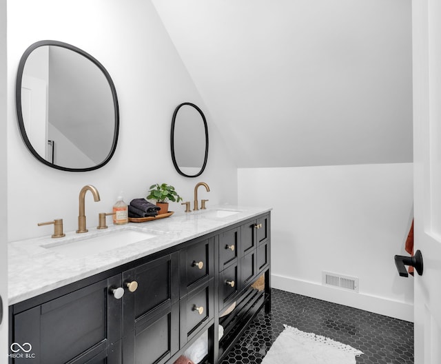 3215 N Pennsylvania St, Indianapolis, IN 46205 - bathroom with vaulted ceiling and double vanity
