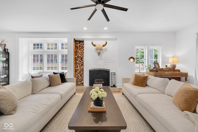 3215 N Pennsylvania St, Indianapolis, IN 46205 - living room with a ceiling fan, a fireplace, and recessed lighting