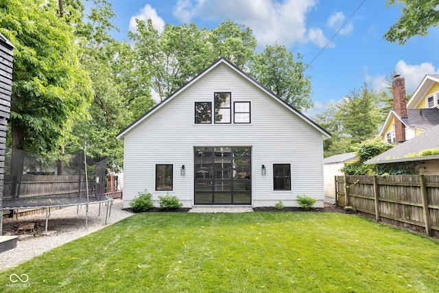 3215 N Pennsylvania St, Indianapolis, IN 46205 - rear view of house with a trampoline