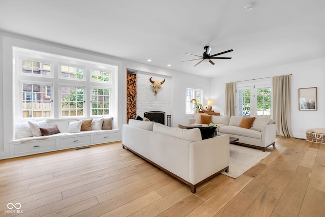 3215 N Pennsylvania St, Indianapolis, IN 46205 - living area featuring a ceiling fan, light wood-type flooring, a large fireplace, and recessed lighting