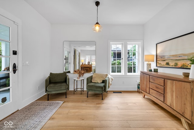 3215 N Pennsylvania St, Indianapolis, IN 46205 - living area with light wood-style floors, healthy amount of natural light, and baseboards