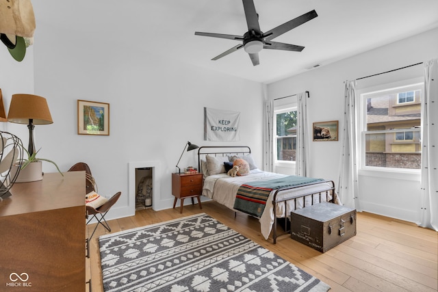 3215 N Pennsylvania St, Indianapolis, IN 46205 - bedroom with light wood-style floors, baseboards, and a ceiling fan