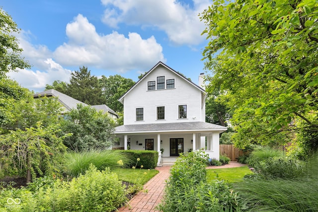 3215 N Pennsylvania St, Indianapolis, IN 46205 - view of front facade featuring covered porch and a chimney