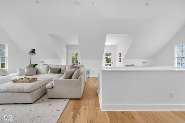 3215 N Pennsylvania St, Indianapolis, IN 46205 - living area with vaulted ceiling, light wood-style floors, and healthy amount of natural light