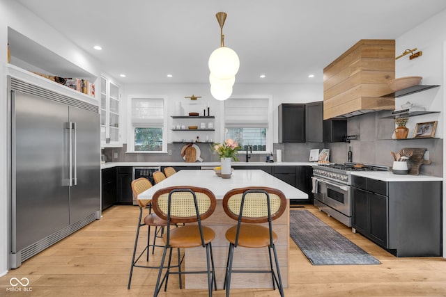 3215 N Pennsylvania St, Indianapolis, IN 46205 - kitchen featuring open shelves, high end appliances, dark cabinetry, and recessed lighting