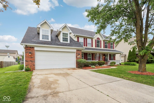 4434 W Windsong Ct, New Palestine, IN 46163 - view of front facade featuring a porch, concrete driveway, a garage, brick siding, and a shingled roof