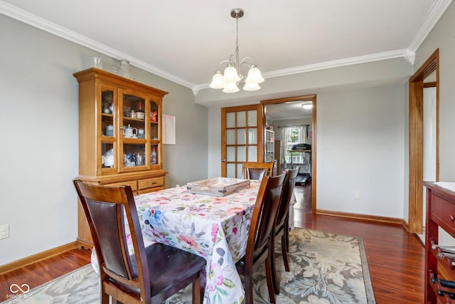 4434 W Windsong Ct, New Palestine, IN 46163 - dining space featuring ornamental molding, dark wood-type flooring, a chandelier, and baseboards