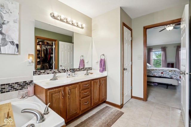 4434 W Windsong Ct, New Palestine, IN 46163 - full bathroom featuring ensuite bathroom, double vanity, tile patterned flooring, ceiling fan, and a bath