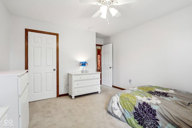 4434 W Windsong Ct, New Palestine, IN 46163 - bedroom with light carpet, a ceiling fan, and baseboards
