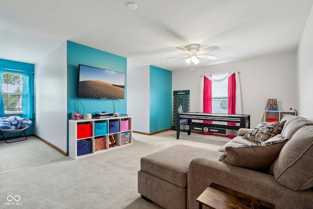 4434 W Windsong Ct, New Palestine, IN 46163 - living room featuring carpet floors, healthy amount of natural light, ceiling fan, and baseboards