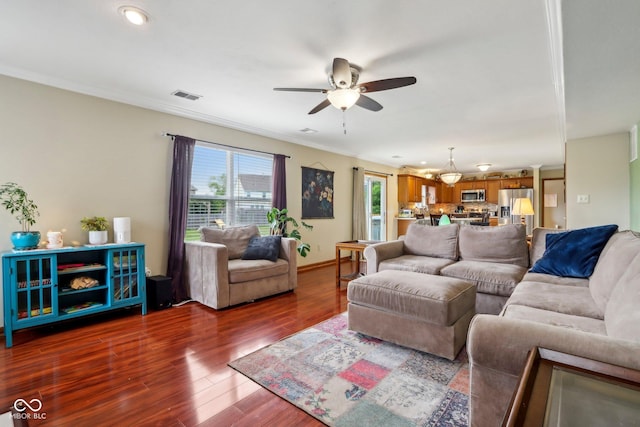 4434 W Windsong Ct, New Palestine, IN 46163 - living area featuring ceiling fan, dark wood-style floors, crown molding, and baseboards
