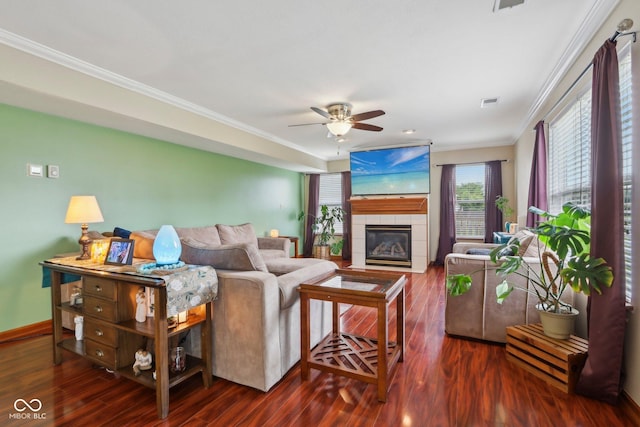 4434 W Windsong Ct, New Palestine, IN 46163 - living room with ornamental molding, ceiling fan, a fireplace, wood finished floors, and baseboards