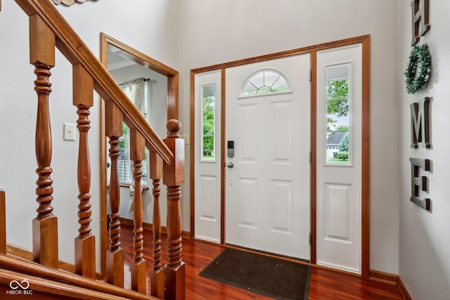 4434 W Windsong Ct, New Palestine, IN 46163 - foyer entrance with dark wood-style floors, stairs, and baseboards