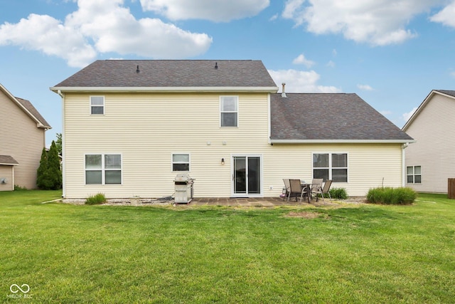 4434 W Windsong Ct, New Palestine, IN 46163 - rear view of house featuring a lawn, a patio, and a shingled roof