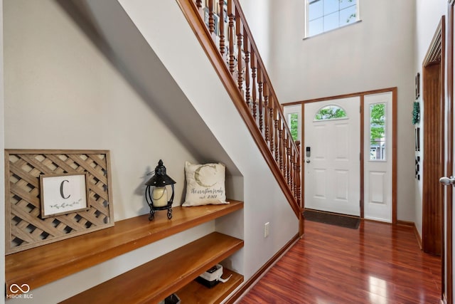 4434 W Windsong Ct, New Palestine, IN 46163 - foyer entrance featuring a towering ceiling, dark wood-style flooring, and stairs
