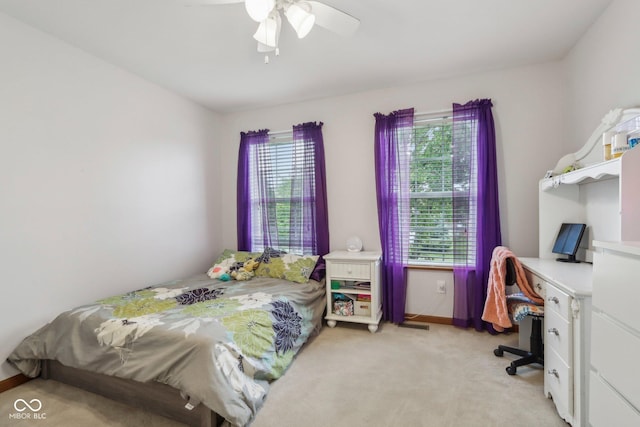 4434 W Windsong Ct, New Palestine, IN 46163 - bedroom with multiple windows, light carpet, and a desk