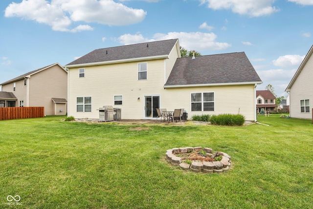4434 W Windsong Ct, New Palestine, IN 46163 - back of house featuring a patio, an outdoor fire pit, and a shingled roof